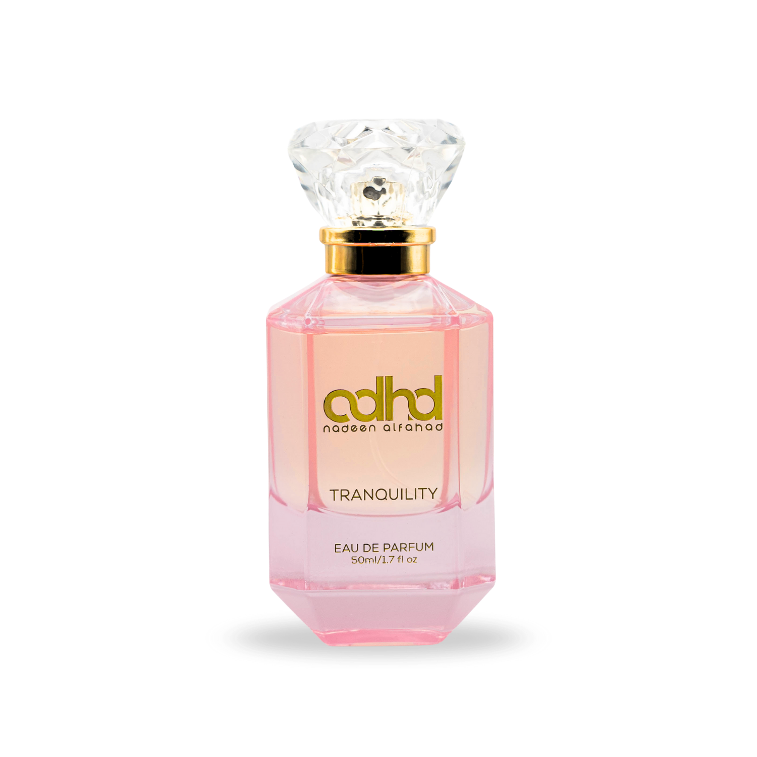 Pink colored perfume bottle with a diamond shape cap. In golden letters it reads "ADHD Tranquility"