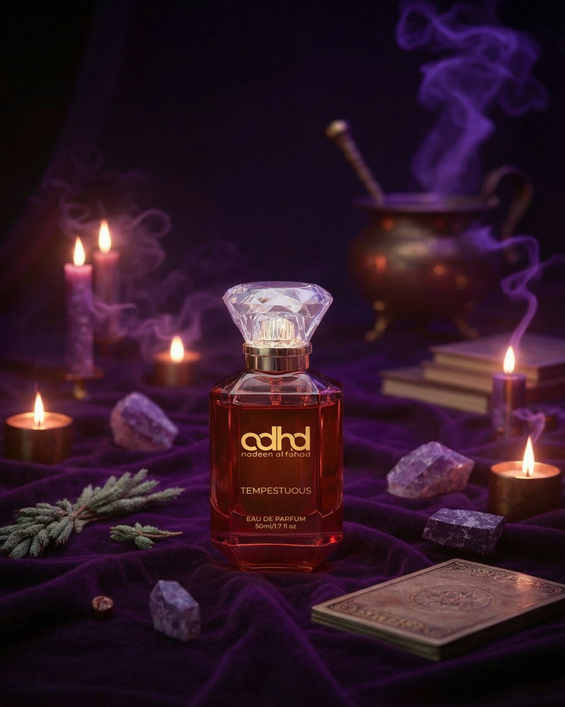 Tempestuous perfume bottle among candles, crystals and purple smoke